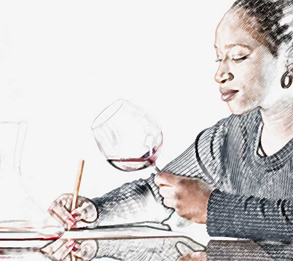 Sommelier taking tasting notes on tablet