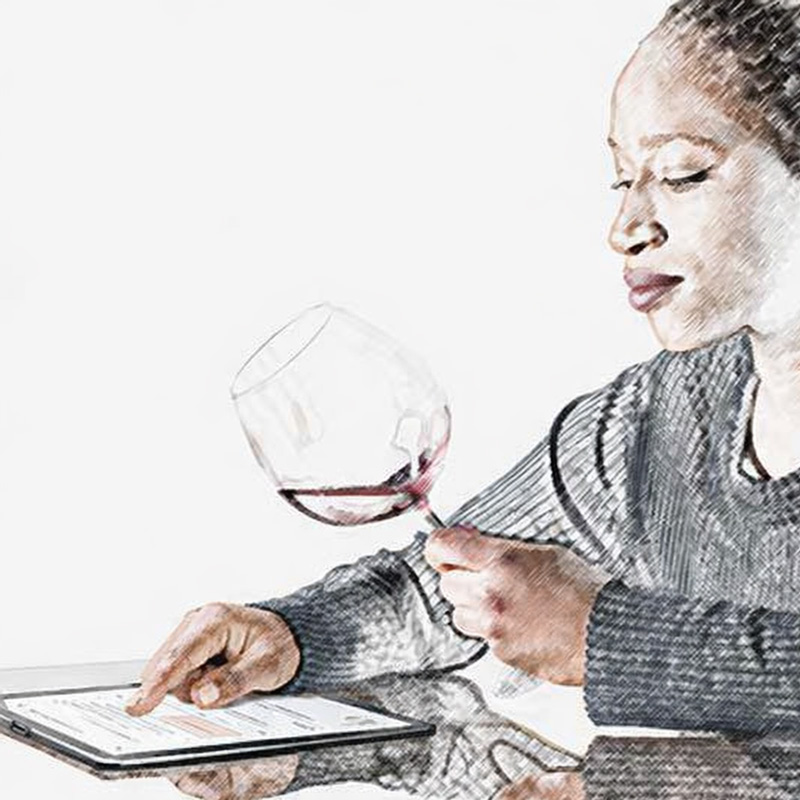 Sommelier taking tasting notes on tablet